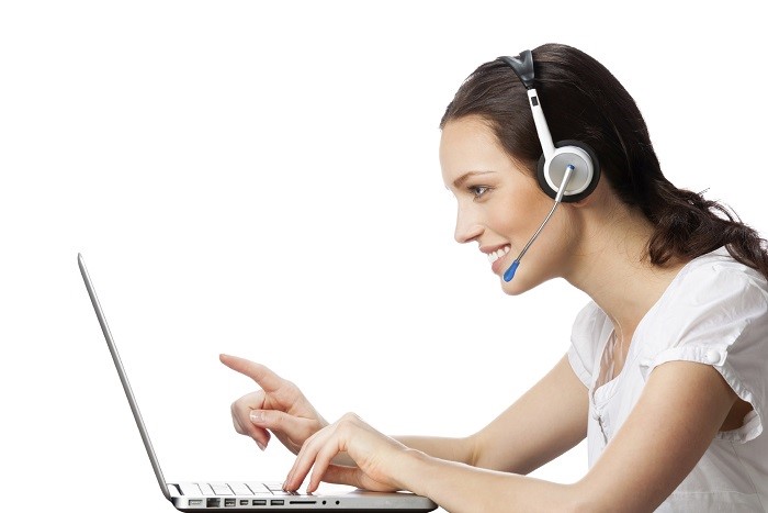 Support phone operator in headset at workplace, isolated on whit
