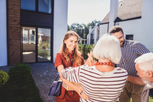 Positive delighted people meeting together at home